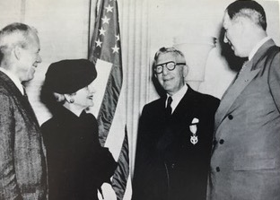 In 1958, Fannie and John were invited to the Pentagon, where they were recognized for their dedication to service in defense of the United States, as exemplified by their endowment of the Hertz Foundation. Defense Secretary Neil McElroy presented them with the Certificate of Appreciation, the Defense Department’s highest civilian award at the time.  During both World War I and World War II, John was an advisor to the military on wheeled vehicles. At a ceremony in 1947, pictured here, Secretary of War Robert P. Patterson (left) recognized John for his contribution with the Department of Defense’s Medal and Certificate of Merit.