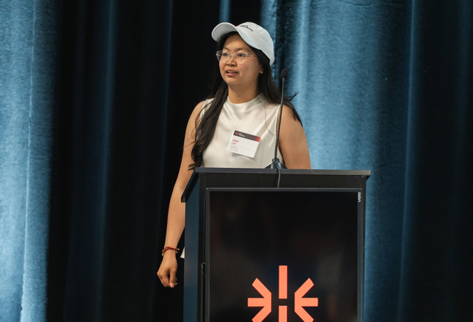 Ruby Lai getting ready to speak on stage at the Hertz Foundation event Hertz Fellow prepares to deliver remarks